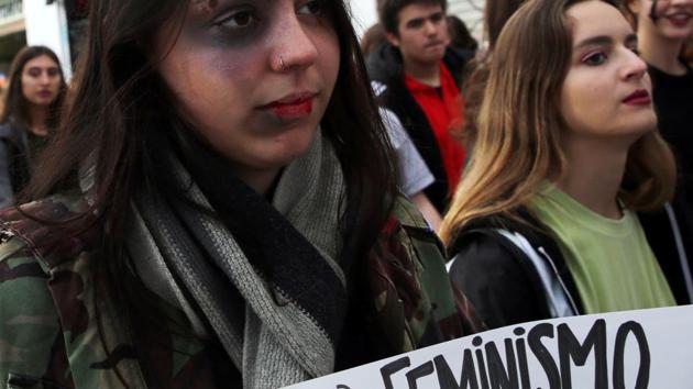 A woman wearing make-up holds a sign that reads ’I need feminism’ during a protest against femicides and violence against women, Buenos Aires, Argentina (Representative Photo)(REUTERS) A woman wearing make-up holds a sign that reads ’I need feminism’ during a protest against femicides and violence against women, Buenos Aires, Argentina (Representative Photo)(REUTERS)