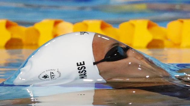 Canada’s Kylie Masses caught just as she breaks the surface during the women's swimming 50m backstroke semifinal 2 at the Optus Aquatic Centre on April 9, 2018. (David Gray / REUTERS)