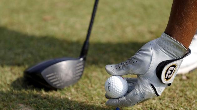 A golfer places a golf ball and tee at the Poona Golf Course on Airport Road in Yerawada in Pune. (RAHUL RAUT/HT PHOTO) A golfer places a golf ball and tee at the Poona Golf Course on Airport Road in Yerawada in Pune. (RAHUL RAUT/HT PHOTO)