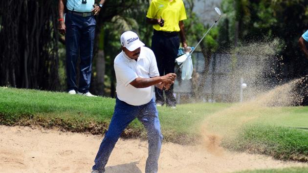 A golfer hits a ball out of a sand trap during the PGTI tournament in Pune on April 10. (SHANKAR NARAYAN/HT PHOTO) A golfer hits a ball out of a sand trap during the PGTI tournament in Pune on April 10. (SHANKAR NARAYAN/HT PHOTO)