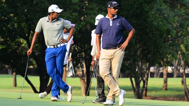 Adhithya Bhandarkar (right) and his opponent wait for their chance during the PGTI tournament in Pune on April 10. (SHANKAR NARAYAN/HT PHOTO) Adhithya Bhandarkar (right) and his opponent wait for their chance during the PGTI tournament in Pune on April 10. (SHANKAR NARAYAN/HT PHOTO)