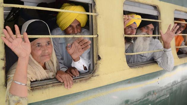 Sikh Pilgrims wave from their train at Attari Railway Station before leaving on special service to Lahore to celebrate the Baisakhi festival in Pakistan, on the outskirts of Amritsar on April 12, 2018. Thousands of Indian Sikh pilgrims are travelling to Pakistan for Baisakhi's celebrations, the Sikh New Year at the Sikh Shrine of Gurudwara Panja Sahib and Nankana Sahib, the birthplace of Sikh founder Guru Nanak Dev. (Narinder Nanu / AFP) Sikh Pilgrims wave from their train at Attari Railway Station before leaving on special service to Lahore to celebrate the Baisakhi festival in Pakistan, on the outskirts of Amritsar on April 12, 2018. Thousands of Indian Sikh pilgrims are travelling to Pakistan for Baisakhi's celebrations, the Sikh New Year at the Sikh Shrine of Gurudwara Panja Sahib and Nankana Sahib, the birthplace of Sikh founder Guru Nanak Dev. (Narinder Nanu / AFP)