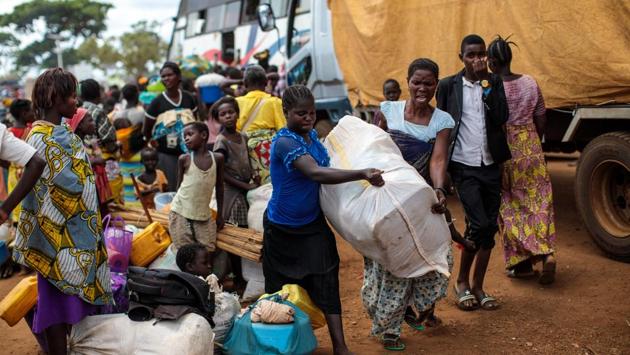 Displaced refugees from the DRC prepare to be resettled at the Kagoma reception centre in Kyangwali. With refugee settlements in Uganda almost at maximum capacity there are plans for new settlements to be built to deal with the continuing influx of people. (Jack Taylor / Getty Images)