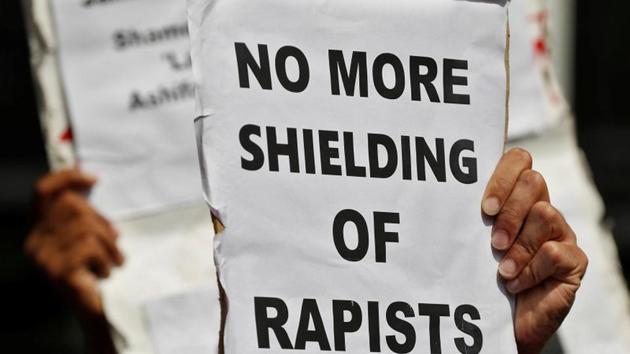 People hold placards at a protest against the rape of an eight-year-old girl, in Kathua, near Jammu and a teenager in Unnao, Uttar Pradesh state, in New Delhi, on Thursday. (Reuters photo) People hold placards at a protest against the rape of an eight-year-old girl, in Kathua, near Jammu and a teenager in Unnao, Uttar Pradesh state, in New Delhi, on Thursday. (Reuters photo)