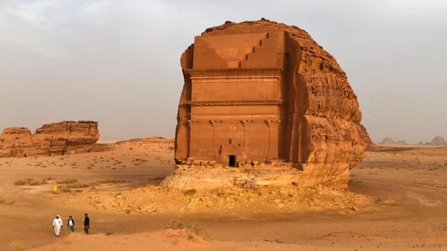 The Qasr al-Farid tomb (The Lonely Castle) carved into rose-coloured sandstone in Madain Saleh, a UNESCO World Heritage site, stands in the dunes near al-Ula. Saudi Crown Prince Mohammed bin Salman signed a landmark agreement with Paris on Tuesday for the touristic and cultural development of the northwestern site, once a crossroads of ancient civilisations. (Fayez Nureldine / AFP) The Qasr al-Farid tomb (The Lonely Castle) carved into rose-coloured sandstone in Madain Saleh, a UNESCO World Heritage site, stands in the dunes near al-Ula. Saudi Crown Prince Mohammed bin Salman signed a landmark agreement with Paris on Tuesday for the touristic and cultural development of the northwestern site, once a crossroads of ancient civilisations. (Fayez Nureldine / AFP)