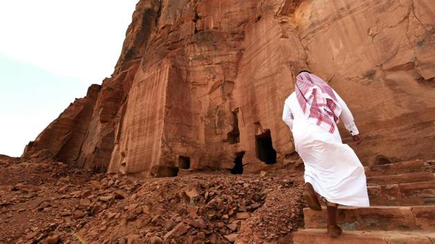 Trudging up a caramel-hued cliff pocked with ancient tombs, guide Bandar al-Anazi gazed at a windswept desert landscape of pre-Islamic ruins at the centre of Saudi-Franco preservation efforts. Al-Ula, rich in archaeological remnants, is seen as a jewel in the crown of future Saudi attractions as the kingdom prepares to issue tourist visas -- opening up one of the last frontiers of global tourism. (Fayez Nureldine / AFP) Trudging up a caramel-hued cliff pocked with ancient tombs, guide Bandar al-Anazi gazed at a windswept desert landscape of pre-Islamic ruins at the centre of Saudi-Franco preservation efforts. Al-Ula, rich in archaeological remnants, is seen as a jewel in the crown of future Saudi attractions as the kingdom prepares to issue tourist visas -- opening up one of the last frontiers of global tourism. (Fayez Nureldine / AFP)