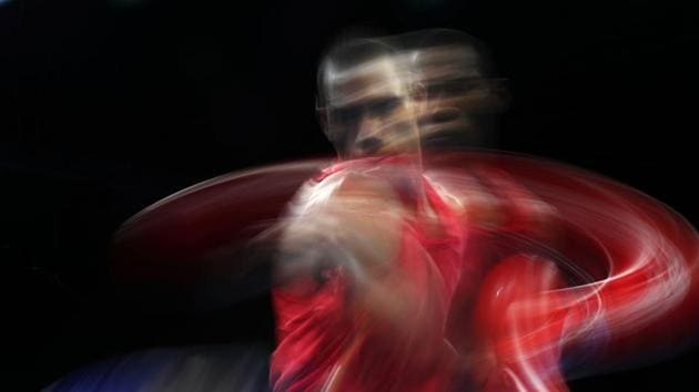 St. Lucia's Marvin Anthony (in red) throws a punch at Cameroon's Dieudonne Wilfred Seyi Ntsengue during the men’s middle (75Kg) category preliminary fight at Oxenford Studios venue on April 6, 2018. (Adrian Dennis / AFP)