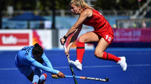Sophie Bray of England (R) jumps as Deep Grace Ekka of India hits the ball during the women's field hockey match between India and England at the 2018 Gold Coast Commonwealth Games. (Anthony Wallace / AFP) Sophie Bray of England (R) jumps as Deep Grace Ekka of India hits the ball during the women's field hockey match between India and England at the 2018 Gold Coast Commonwealth Games. (Anthony Wallace / AFP)