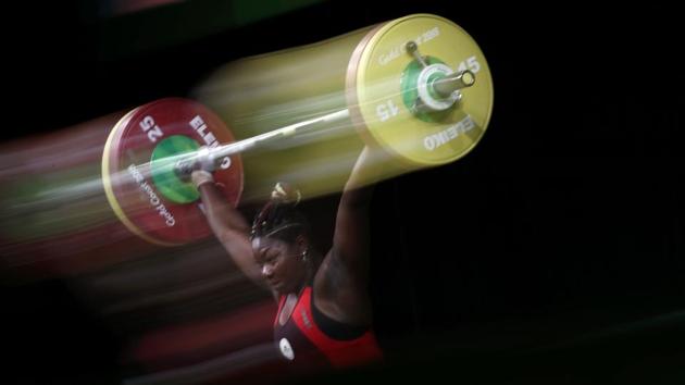 Cameroon's Clementine Meukeugni Noubissi competes during the women's 90kg weightlifting final on April 9, 2018. (Adrian Dennis / AFP)