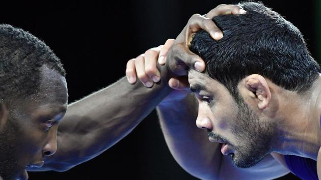 Sushil Kumar (R) wrestles against Canada’s Jevon Balfour during the men’s freestyle 74 kg wrestling match at the 2018 Gold Coast Commonwealth Games in the Carrara Sports Arena on the Gold Coast on April 12, 2018. It was Sushil Kumar’s third straight Commonwealth Games gold medal and India’s second gold from the wrestling mat of CWG 2018. (Saeed Khan / AFP) Sushil Kumar (R) wrestles against Canada’s Jevon Balfour during the men’s freestyle 74 kg wrestling match at the 2018 Gold Coast Commonwealth Games in the Carrara Sports Arena on the Gold Coast on April 12, 2018. It was Sushil Kumar’s third straight Commonwealth Games gold medal and India’s second gold from the wrestling mat of CWG 2018. (Saeed Khan / AFP)