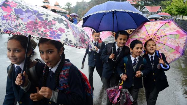 Umbrellas were out today on the Ridge, as children met an afternoon drizzle on their way back from school in Shimla on April 11, 2018. (Deepak Sansta / HT Photo) Umbrellas were out today on the Ridge, as children met an afternoon drizzle on their way back from school in Shimla on April 11, 2018. (Deepak Sansta / HT Photo)