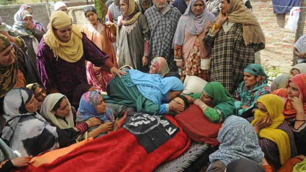 Relatives and neighbours mourn near the dead body of Sharjeel Ahmed who was killed near the encounter site at Khudwani district of Kashmir on April 11, 2018. (Waseem Andrabi / HT Photo) Relatives and neighbours mourn near the dead body of Sharjeel Ahmed who was killed near the encounter site at Khudwani district of Kashmir on April 11, 2018. (Waseem Andrabi / HT Photo)