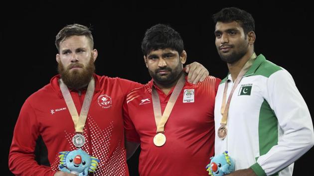 Indian wrestler Sumit Malik claimed a gold in men’s freestyle 125 kg after his opponent, Nigeria’s Sinivie Boltic was ruled out of the final due to an injury. (AP) Indian wrestler Sumit Malik claimed a gold in men’s freestyle 125 kg after his opponent, Nigeria’s Sinivie Boltic was ruled out of the final due to an injury. (AP)