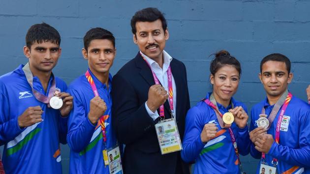 Union Sports Minister Rajyavardhan Singh Rathore poses with medal winners MC Mary Kom, Gaurav Solanki, Manish Kaushik and Amit at the Commonwealth Games 2018 in Gold Coast, on Saturday. (PTI) Union Sports Minister Rajyavardhan Singh Rathore poses with medal winners MC Mary Kom, Gaurav Solanki, Manish Kaushik and Amit at the Commonwealth Games 2018 in Gold Coast, on Saturday. (PTI)