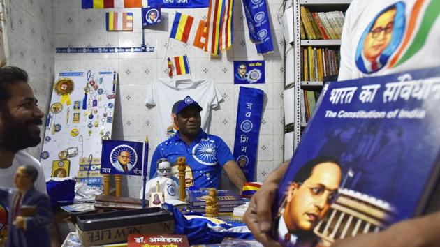 The business is brisk offline too. Anuj Kumar (C), 38, who runs the city’s only exclusive Dalit bookstore at Ramnagar in Shahdara, which also sells Ambedkar merchandise, said he sold about one lakh T-shirts in the past one month. (Raj K Raj / HT Photo) The business is brisk offline too. Anuj Kumar (C), 38, who runs the city’s only exclusive Dalit bookstore at Ramnagar in Shahdara, which also sells Ambedkar merchandise, said he sold about one lakh T-shirts in the past one month. (Raj K Raj / HT Photo)