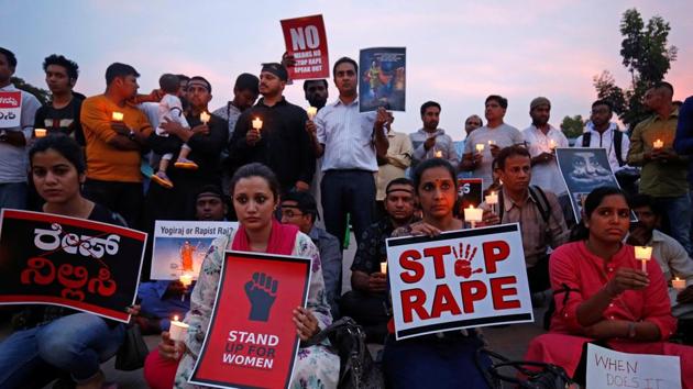 People participate in a candle light vigil as they protest against the rape of an eight-year-old girl in Kathua near Jammu, and a teenager in Unnao, Uttar Pradesh state, in Bengaluru.(Reutersfile photo)