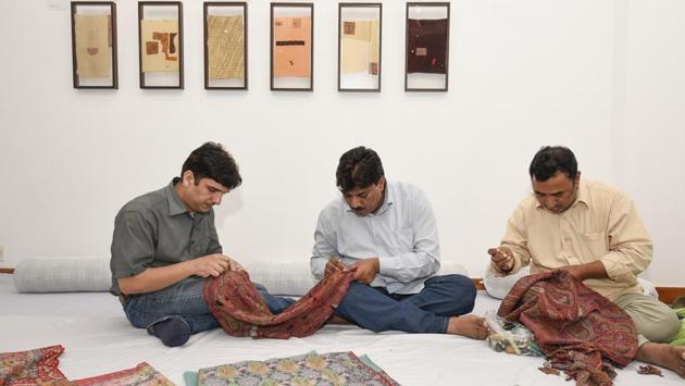 Arif Anvar, Mohammad Zakir and Intekhab Ahmed are sixth generation rafoogars from Najibabad. Survival by carrying forward an art that people are barely aware of is difficult. Zakir said that work comes from studios and private clients. They also travel in search of work and are in Delhi for around five months every year, when the business of Kashmiri shawl traders is at peak. (Burhaan Kinu / HT Photo) Arif Anvar, Mohammad Zakir and Intekhab Ahmed are sixth generation rafoogars from Najibabad. Survival by carrying forward an art that people are barely aware of is difficult. Zakir said that work comes from studios and private clients. They also travel in search of work and are in Delhi for around five months every year, when the business of Kashmiri shawl traders is at peak. (Burhaan Kinu / HT Photo)