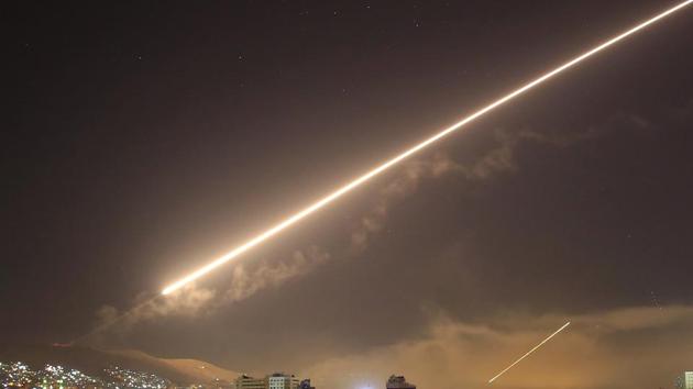 Damascus skies erupt with service to air missile fire as the US launches an attack on Syria targeting different parts of the capital city on Saturday.(AP Photo)