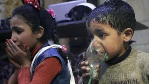 This image released early Sunday, April 8, 2018 by the Syrian Civil Defense White Helmets, shows a child receiving oxygen through respirators following an alleged poison gas attack in the rebel-held town of Douma, near Damascus, Syria.(AP)