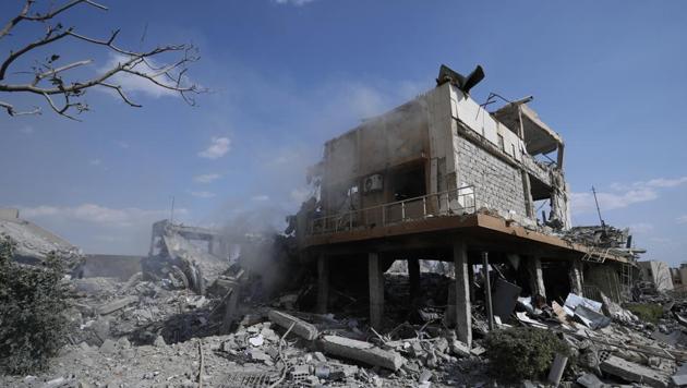 Damage is shown of the Syrian Scientific Research Center which was attacked by U.S., British and French military strikes to punish President Bashar Assad for suspected chemical attack against civilians, in Barzeh, near Damascus, Syria, Saturday, April 14, 2018.(AP Photo)