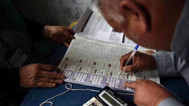 This photo taken on April 14, 2018 shows Afghan employees of the Independent Election Commission (IEC) registering a resident at a voter registration center in Kabul. If held, candidates will contest the 249 seats in the National Assembly for five-year terms. (AFP) This photo taken on April 14, 2018 shows Afghan employees of the Independent Election Commission (IEC) registering a resident at a voter registration center in Kabul. If held, candidates will contest the 249 seats in the National Assembly for five-year terms. (AFP)