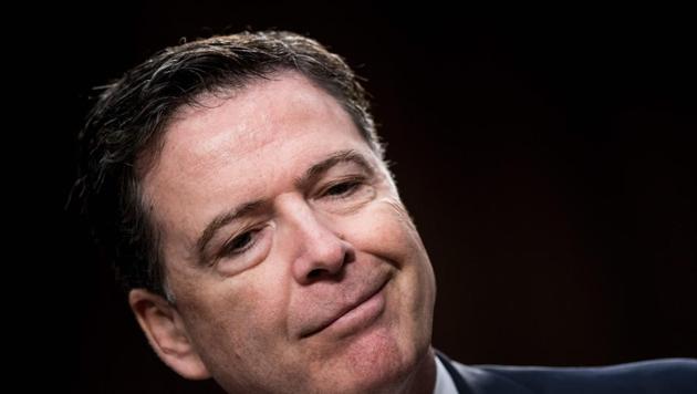 Ousted FBI director James Comey smiles during a hearing before the Senate Select Committee on Intelligence on Capitol Hill in Washington, DC. Comey says in a new book that President Donald Trump reminded him of a mafia boss who demanded absolute loyalty.(AFP File Photo)