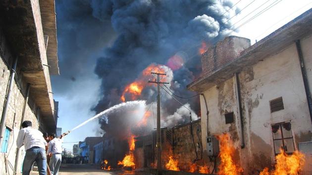 Firefighters douse a fire at Bais Godown in Jaipur. Repeated incidents of fire in the past few months in the city have kept the fire department personnel on their toes.(HT File)