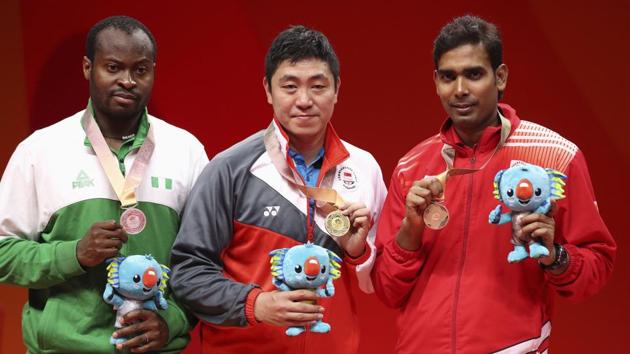 Gao Ning of Singapore (C) is flanked by silver medallist Quadri Aruna of Nigeria (L) and bronze medallist Sharath Kamal. (REUTERS)