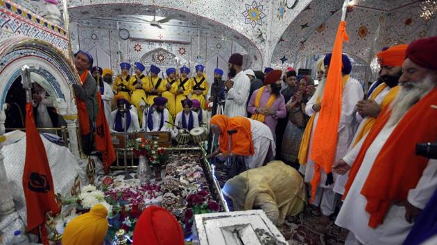 Sikh pilgrims pray during the Baisakhi festival at the shrine of Gurdwara Punja Sahib, the second most sacred place for Sikhs, in Hasan Abdal, some 50 kilometers from Islamabad, in Pakistan, on April 14, 2018. Thousands of Sikh pilgrims arrived from India and other countries to attend the harvest festival that is regionally known by many names and marks the Solar New Year.(AP)