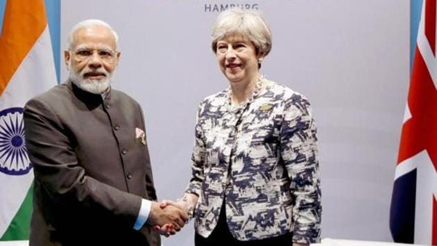 Prime Minister Narendra Modi meets Britain's Prime Minister Theresa May on the sidelines of the 12th G-20 Summit, in Hamburg, Germany.(PTI File Photo)