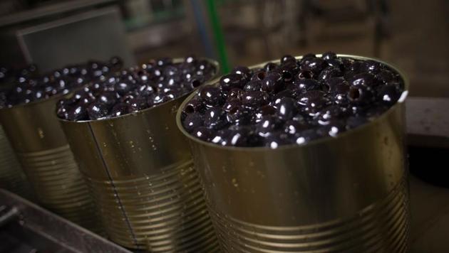 Black olives are pictured at the "Agro Sevilla" factury in La Roda de Andalucia on April 12, 2018. AgroSevilla exports 25% of its annual production to the United States and the factory has been specially calibrated to supply this crucial customer. (AFP) Black olives are pictured at the "Agro Sevilla" factury in La Roda de Andalucia on April 12, 2018. AgroSevilla exports 25% of its annual production to the United States and the factory has been specially calibrated to supply this crucial customer. (AFP)