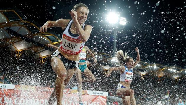 Athletes compete in the women's 3000m steeplechase final during the 2018 Gold Coast Commonwealth Games at the Carrara Stadium on the Gold Coast, Australia on April 11, 2018. (Adrian Dennis / AFP)
