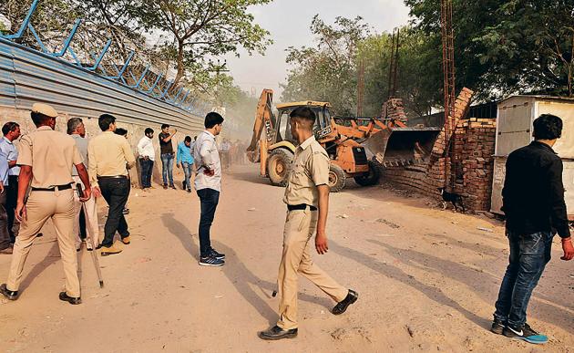 MCG officials said although there was brief resistance from residents at one of the four residential buildings within the restricted area, the matter was quickly resolved without violence due to the heavy police deployment.(Parveen Kumar/HT PHOTO) MCG officials said although there was brief resistance from residents at one of the four residential buildings within the restricted area, the matter was quickly resolved without violence due to the heavy police deployment.(Parveen Kumar/HT PHOTO)