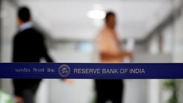 People walk past a barricade inside the Reserve Bank of India (RBI) headquarters in Mumbai. (Reuters File Photo) People walk past a barricade inside the Reserve Bank of India (RBI) headquarters in Mumbai. (Reuters File Photo)