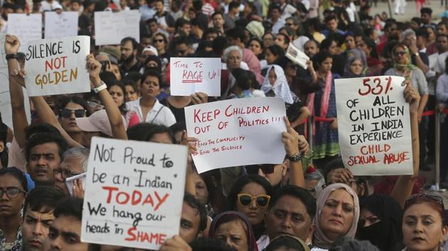 People hold placards during a protest against recent incidents of rape in the country, in Mumbai, on Sunday.(AP Photo)