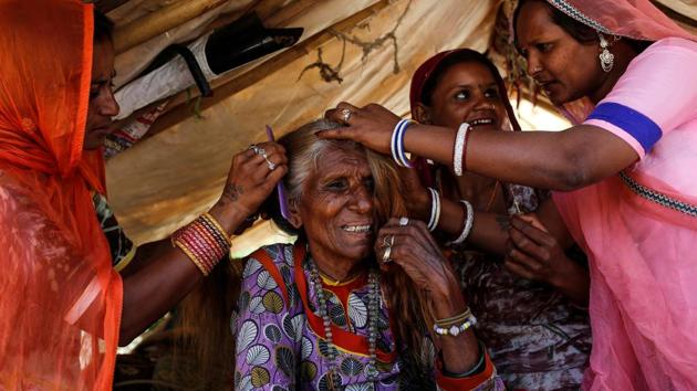 Movan, 77, is helped by her relatives as prepares to leave for her cataract surgery on the Lifeline Express. “I am never going to forget the name of this train, never in my life,” Movan said. Like Devi, the poor are caught between relying on a public health system trusted by few, or selling meagre assets to fund private treatment. (Danish Siddiqui / REUTERS) Movan, 77, is helped by her relatives as prepares to leave for her cataract surgery on the Lifeline Express. “I am never going to forget the name of this train, never in my life,” Movan said. Like Devi, the poor are caught between relying on a public health system trusted by few, or selling meagre assets to fund private treatment. (Danish Siddiqui / REUTERS)