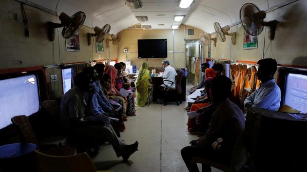 Patients wait for dental checkups on the Lifeline Express. Typically, it spends a month in a district, performing surgery ranging from cataracts and cancer to cleft palates and orthopaedics. The aim is not to compete with public healthcare, but support it. A second train is also in the works to cover the north and northeast. (Danish Siddiqui / REUTERS) Patients wait for dental checkups on the Lifeline Express. Typically, it spends a month in a district, performing surgery ranging from cataracts and cancer to cleft palates and orthopaedics. The aim is not to compete with public healthcare, but support it. A second train is also in the works to cover the north and northeast. (Danish Siddiqui / REUTERS)