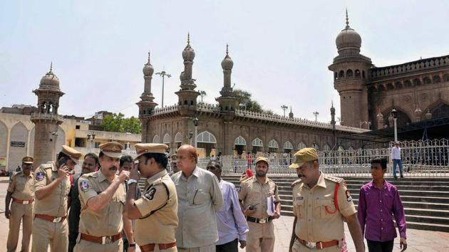 Police officials at the Mecca Masjid in old city of Hyderabad on Monday.(PTI photo)