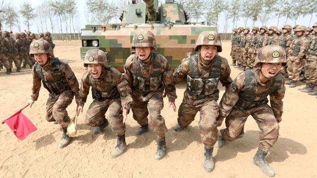 Soldiers of China's People's Liberation Army (PLA) are seen during a military promotional event in Baoding, Hebei province, China March 30.(REUTERS FILE)