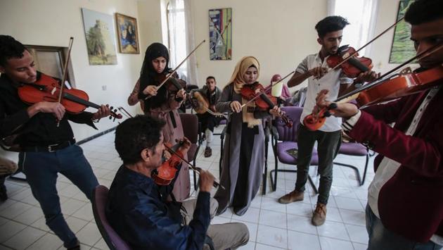 El-Deb’y (C), who is in his early 50s, has academic degrees in both Arabic and Western music and was part of a 40-musician national orchestra created in 1975 that eventually dissolved. (Hani Mohammed / AP) El-Deb’y (C), who is in his early 50s, has academic degrees in both Arabic and Western music and was part of a 40-musician national orchestra created in 1975 that eventually dissolved. (Hani Mohammed / AP)