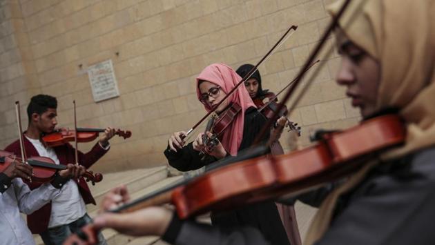 Yemeni music students play violins during a music class at the Cultural Centre in Sanaa, Yemen. For the young people who receive lessons from Abdullah El-Deb’y, music is a safe haven from the misery of Yemen’s devastating war. (Hani Mohammed / AP) Yemeni music students play violins during a music class at the Cultural Centre in Sanaa, Yemen. For the young people who receive lessons from Abdullah El-Deb’y, music is a safe haven from the misery of Yemen’s devastating war. (Hani Mohammed / AP)