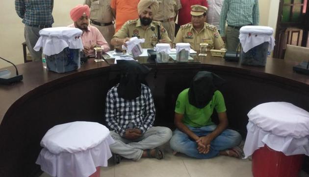 The two accused in police custody.(HT Photo)