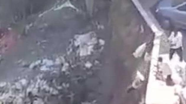 Footage captured on a resident’s phone shows debris being dumped into the national park.(HT Photo) Footage captured on a resident’s phone shows debris being dumped into the national park.(HT Photo)