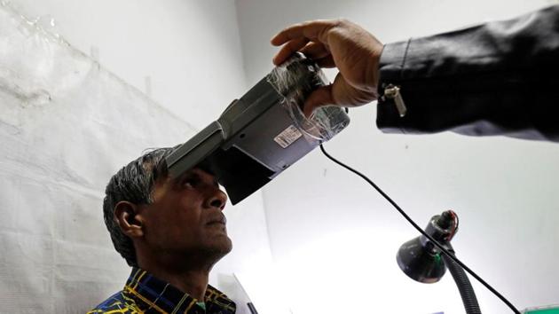 A man goes through the process of eye scanning for the Unique Identification database system, also known as Aadhaar, at a registration centre in New Delhi, January 17 (REUTERS) A man goes through the process of eye scanning for the Unique Identification database system, also known as Aadhaar, at a registration centre in New Delhi, January 17 (REUTERS)