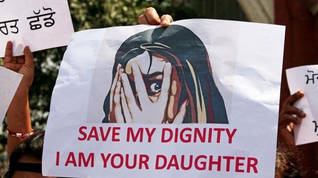 People participate in a protest against the rape of an eight-year-old girl in Kathua near Jammu, and a teenager in Unnao, Uttar Pradesh state, in Amritsar on April 17.(REUTERS)