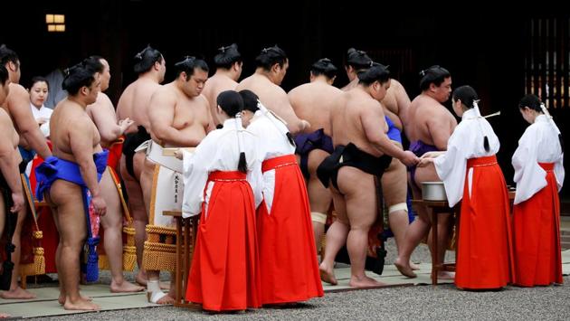 Sumo wrestlers take part in a Shinto ritual before the tournament dedicated to the Yasukuni Shrine begins. One of the more controversial ‘don’ts’ within the sport, although not mentioned on Monday, is the tradition that forbids women from entering the ring on the grounds that it is sacred and their presence, considered “unclean”, would pollute it. (Toru Hanai / REUTERS) Sumo wrestlers take part in a Shinto ritual before the tournament dedicated to the Yasukuni Shrine begins. One of the more controversial ‘don’ts’ within the sport, although not mentioned on Monday, is the tradition that forbids women from entering the ring on the grounds that it is sacred and their presence, considered “unclean”, would pollute it. (Toru Hanai / REUTERS)