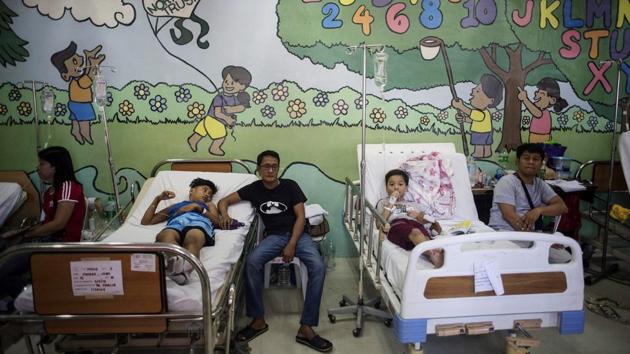Health authorities have said child vaccination against illnesses like measles has dropped by as much as 25 percentage points over the previous year amid anger and mistrust. Several measles outbreaks have claimed at least 13 lives since the controversy began. It has also added to a swirling political battle, fanned by bloggers who back President Rodrigo Duterte and have an audience of millions on Facebook. (Noel Celis / AFP) 