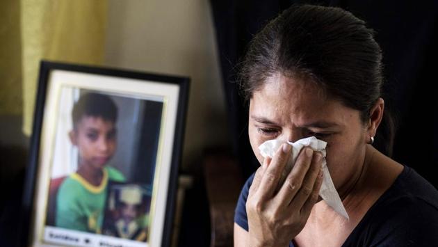 Lilia Alcabasa, the mother of Leiden Alcabasa, 12, believes her son’s death was directly related to his being injected with Dengvaxia. Ronald Mendoza, dean of the Ateneo de Manila University’s School of Government, told AFP that the blame game has taken over the main issue. “It may be doing damage to public health rather than protecting it.” (Noel Celis / AFP) 