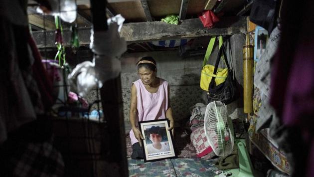 Ruth Jaime, whose 12-year-old grandson Alexzander died due to a blood infection months after his last dose of Dengvaxia, says the situation is clear for her. “Of course no one will admit what caused his death,” said the fishmonger in her home west of Manila. “If you had a healthy child and he dies after getting an injection would you not attribute his death to that?” (Noel Celis / AFP) 