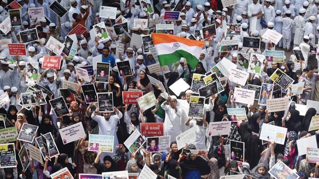 School and madarsa students display placards as they protest the government’s alleged ‘inaction’ in Kathua and Unnao rape cases, in Ahmedabad on April 15, 2018. In the Unnao case, the victim has alleged she was raped by MLA Kuldeep Singh Sengar at his residence on June 4 last year. The teenager attempted self-immolation in front of CM Yogi Adityanath’s residence on April 8 to highlight her ordeal. (Santosh Hirlekar / PTI) 